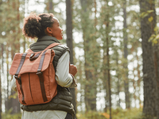 Young Woman with Backpack Outdoors - stock photo/Getty Images