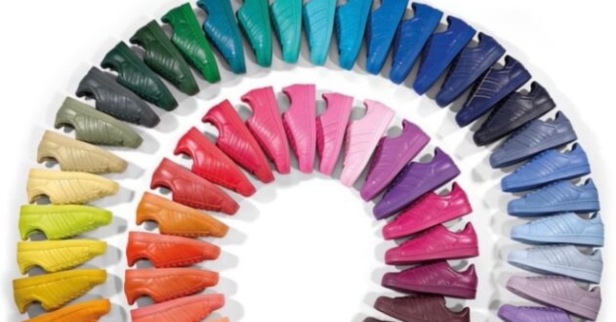 A rainbow-shape of colorful adidas shoes