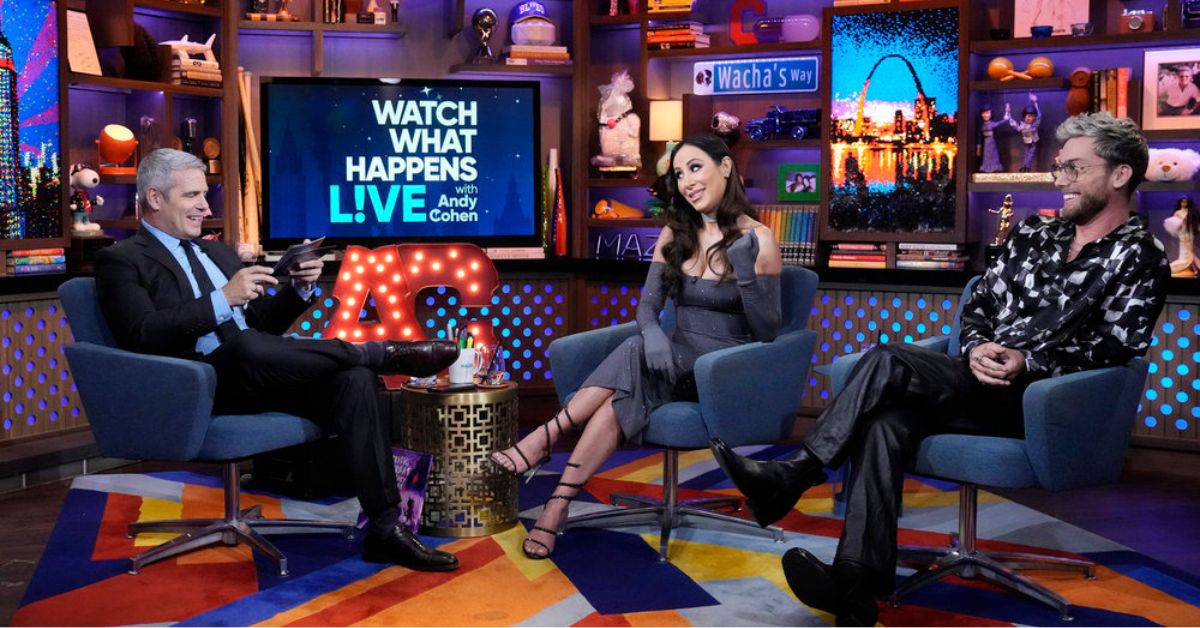 (left-right) Andy Cohen is seated across from Angie Katsanevas and Lance Bass on 'WWHL'