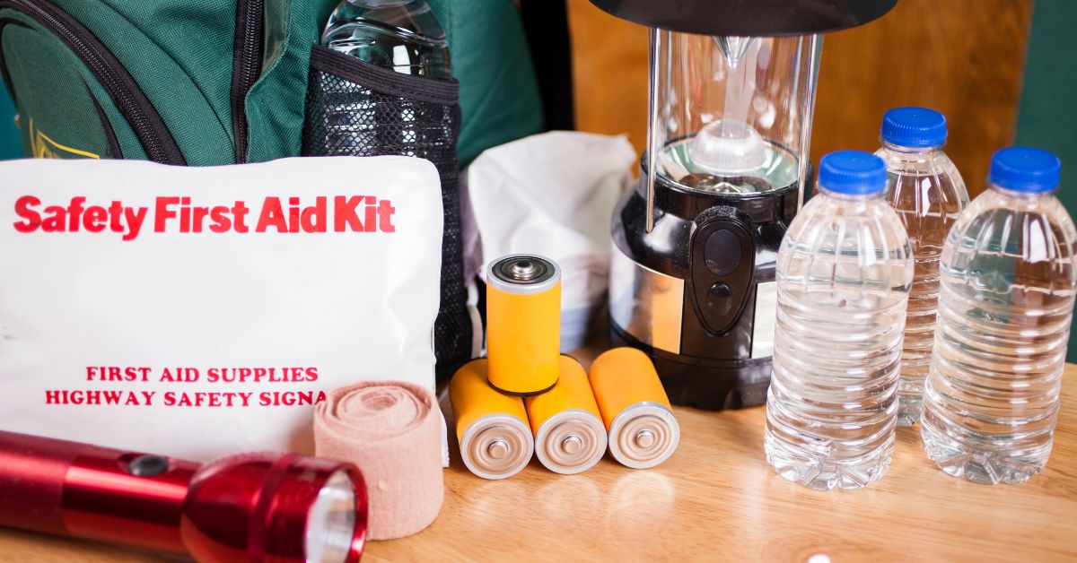  First aid kit, flashlights, and bottles of water to prepare for an emergency.