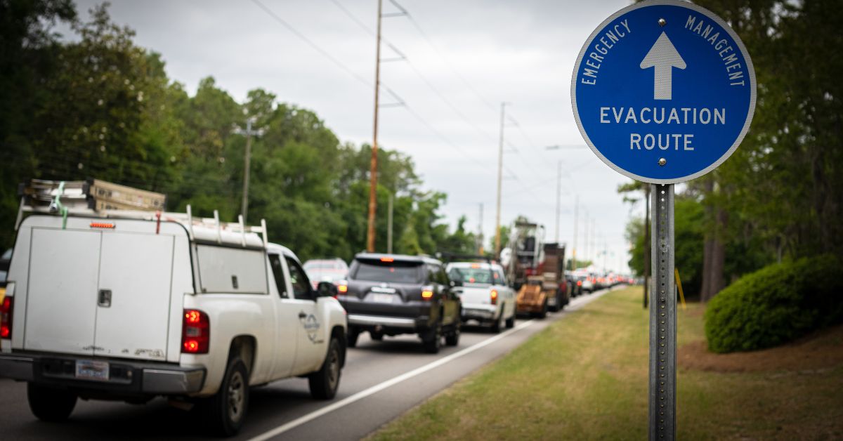 a line of vehicles sitting in traffic on an evacuation route