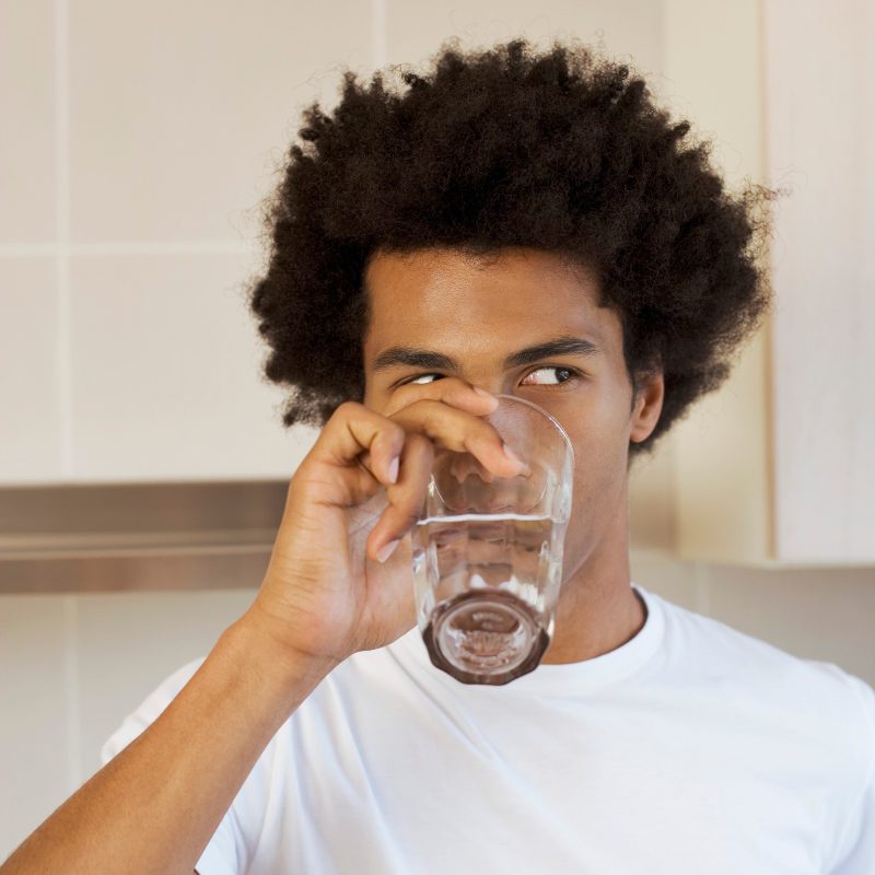 black man drinking water