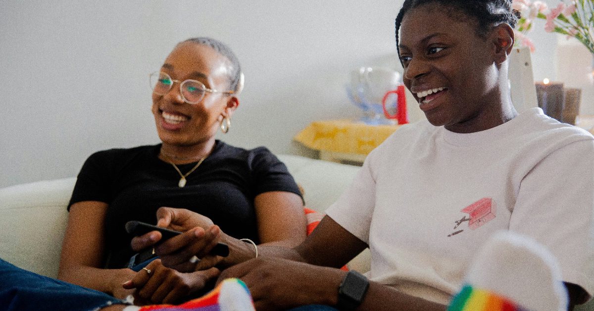 black LGBTQIA couple hold hands