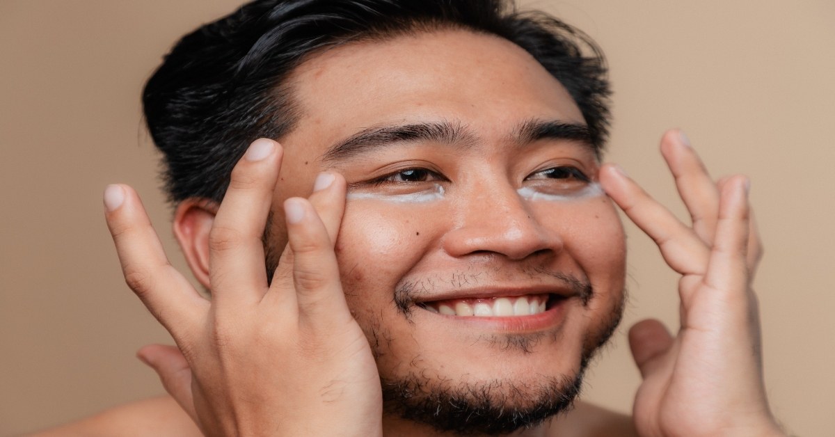 Man applying hydrating moisturizer