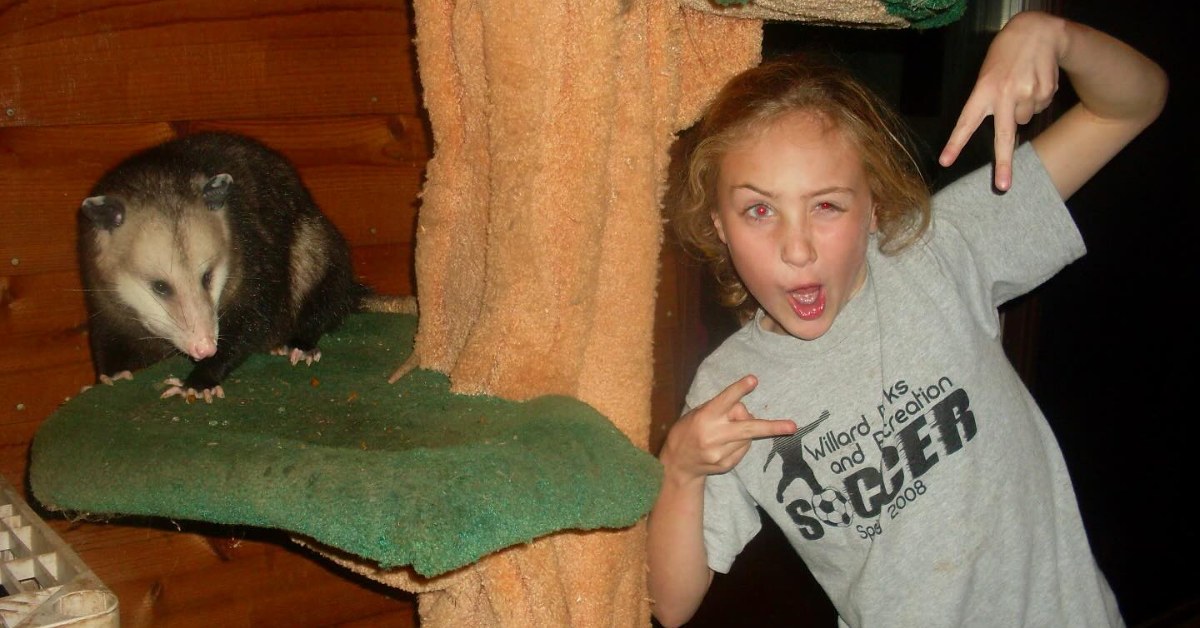 Chappell Roan poses with an opossum. 