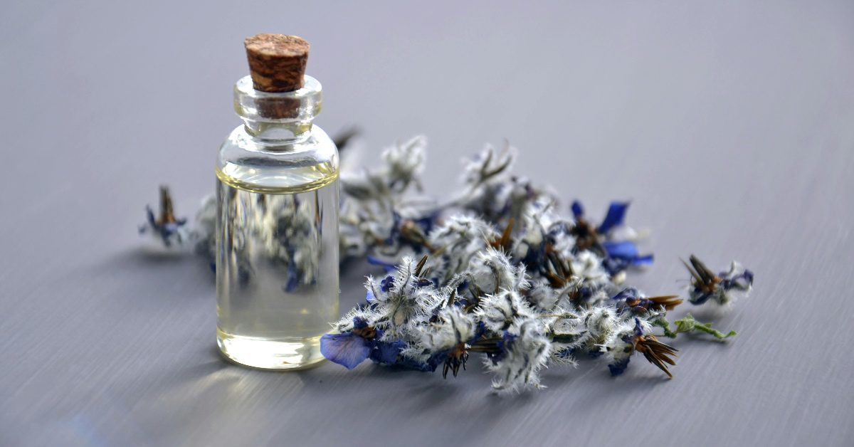 A small bottle of perfume with lavender 